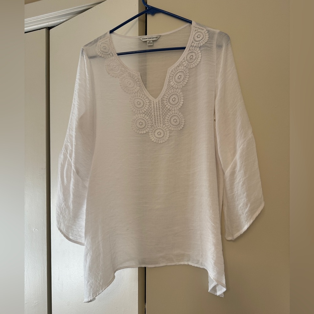 Light summery top with embroidery detail.